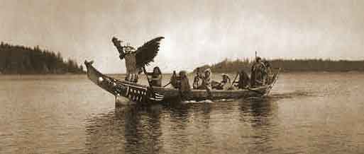  man personating the thunderbird, dances as others row to the shores of