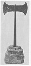 Fig. 9. Double Axe and Stepped Steatite Socket from Dictaean Cave. (Psychro)<br> (From <i>Archæolagia</i>, by kind permission of the Society of Antiquaries, and Sir Arthur Evans)