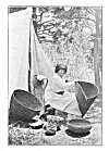 A BASKET MAKER.<BR>
 She is weaving a burden basket. The one to the left is for cooking, and a baby basket stands against the tent.